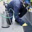 Ant control technician spraying along exterior edges and entry points in {city}, {state}